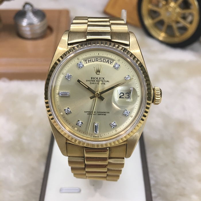 Rolex 劳力士 星期日历型系列，118348。36毫米表径，18K黄金表壳。香槟色面盘，中央时、分及秒针，表面设瞬跳日历及星期显示。自动上弦机械机芯，动力储备48小时。 单表无附件。?