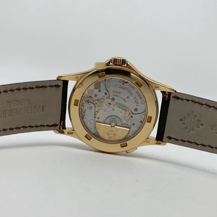 PATEK PHILIPPE 百达翡丽，5110J。37毫米表径，18K黄金表壳，银灰色面盘，月相显示功能，自动上弦机械机芯。 单表无附件。