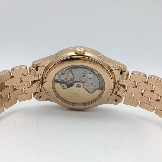 PATEK PHILIPPE 百达翡丽 复杂功能系列，5396R-010。38.5毫米表径，18K玫瑰金表壳，莹白表盘和金质立体时标，视窗式星期、日期和月份显示，以及月相显示。自动上弦机械机芯。  全套附件齐全。
