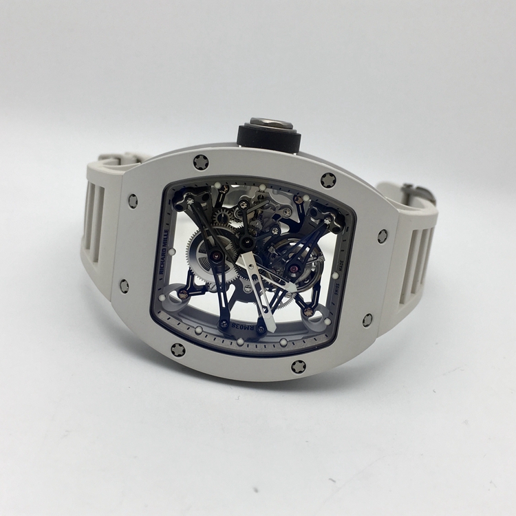 RICHARD MILLE 理查德米勒 男士系列，RM 038。48x39.7毫米表径，镁合金表壳，全镂空酒桶型面盘，陀飞轮装置，RM 038手动上弦机械机芯，动力储备48小时。 单表无附件。