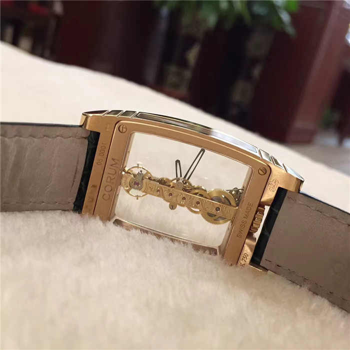 CORUM 昆仑 CORUM  Bridges 昆仑桥系列，113.550.55/0001。32x50毫米表径，全镂空酒桶形，18k玫瑰金壳扣。CO113 自产手动上弦机械机芯，动力储备40小时。 